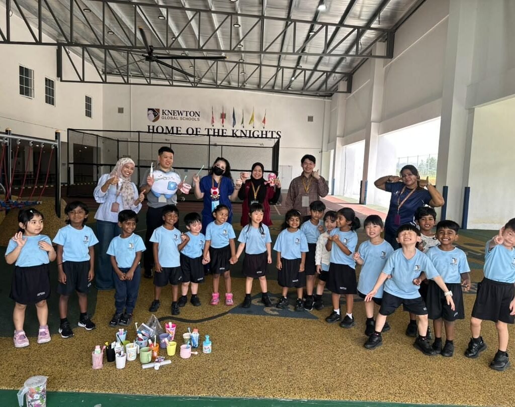 Qualiteeth team with pupils after a dental awareness programme at Knewton International School
