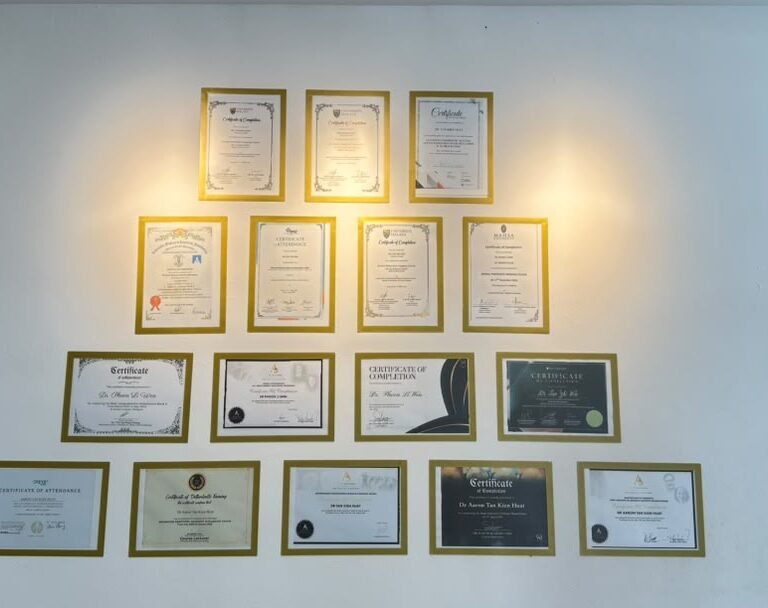 Dentist training certificates on the wall at Qualiteeth Olive Hill